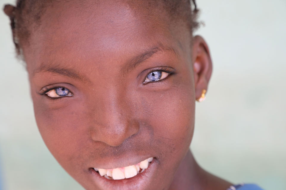 Girl with big blue eyes, looking straight into the camera